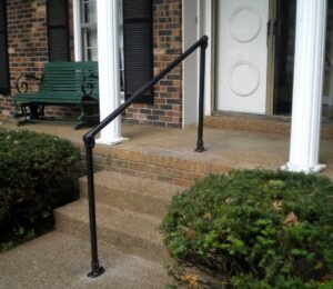 Porch steps with black handrails background for handrail installation services